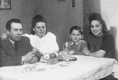 jurek-kaiser-sits-table-friends-relatives-bergen-belsen-displaced-persons-c.jpg