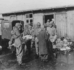 Bergen-Belsen Liberation, April 15, 1945, and Postwar Displaced Persons Camp - Soon after liberation, British medical officers begin disinfection of camp survivors