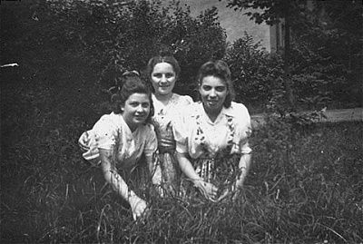 three-teenage-girls-pose-grass-bergen-belsen-displaced-persons-camp.jpg