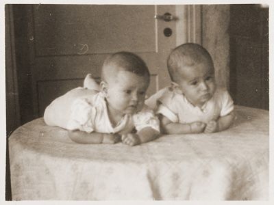 twin-jewish-dp-infants-lie-table-bergen-belsen-displaced-persons-camp.jpg
