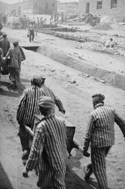 Płaszów Camp in Kraków, Poland, 1942-1945: Amon Göth - Prisoners in Plaszow carry food containers to a work site where it will be distributed
