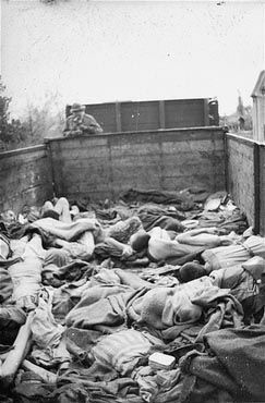 Corpses lie in one of the open railcars of the Dachau death train1.jpg