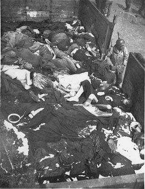 Corpses lie in one of the open railcars of the Dachau death train21.jpg