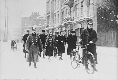 german-police-escort-group-jews-along-snow-covered-street-during-deportation-action-.jpg