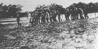 German soldiers lead blindfolded Polish hostages to an execution site.jpg