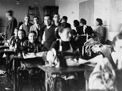 jewish-men-women-working-sewing-workshop-olkusz-ghetto.jpg