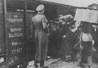 jews are forced into boxcars destined for the Belzec extermination camp. Lublin, Poland, 1942.jpg