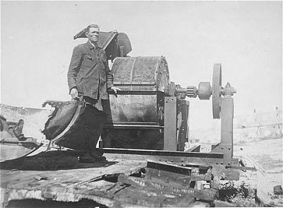 moses-korn-member-sonderkommando-1005-unit-poses-next-bone-crushing-machine.jpg