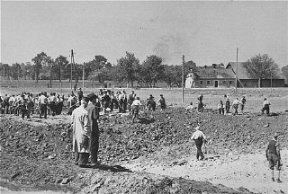 Mauthausen-Gusen Liberation and Mass Graves, Upper Austria, May 1945 - Austrian civilians prepare mass graves to bury former inmates in the Gusen concentration camp