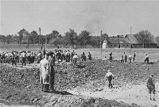 Austrian civilians prepare mass graves to bury former inmates in the Gusen concentration camp.jpg