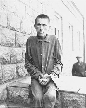 Mauthausen-Gusen Liberation and Mass Graves, Upper Austria, May 1945 - Close up portrait of a survivor in Gusen shortly after the liberation of the camp