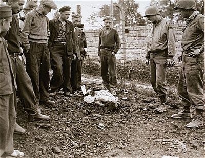 survivors-two-u.s.-army-soldiers-view-corpse-camp-guard-killed-survivors-after-l.jpg