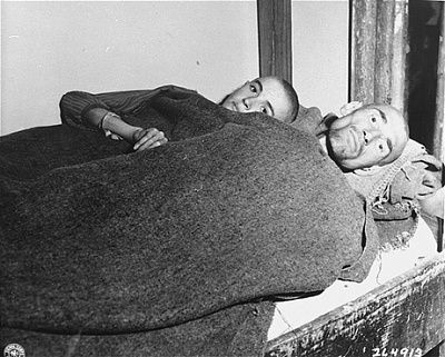 two-emaciated-survivors-lie-single-bed-newly-liberated-gusen-concentration-camp.jpg