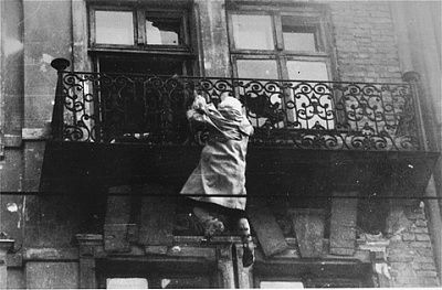 woman-hangs-balcony-preparing-drop-street-waiting-ss.jpg