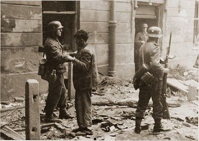 ss-soldier-searches-captured-jewish-resistance-fighter-during-suppression-warsaw.jpg