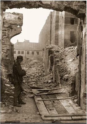 ss-soldier-stands-among-ruins-warsaw-ghetto-during-suppression-uprising.jpg