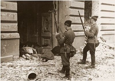 askari-trawniki-guards-peer-into-doorway-past-bodies-killed-jews.jpg