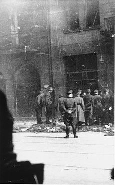 German police and SS personnel arrest Jews on Nowolipie Street in the Warsaw ghetto.jpg