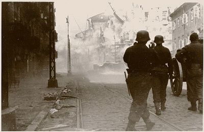 german-soldiers-direct-artillery-against-pocket-resistance-during-warsaw-ghetto-uprisin.jpg