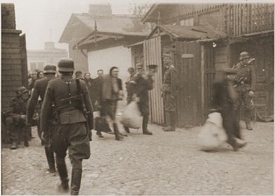 jewish-laborers-forced-ss-troops-evacuate-warsaw-ghetto-factory-during-uprising.jpg
