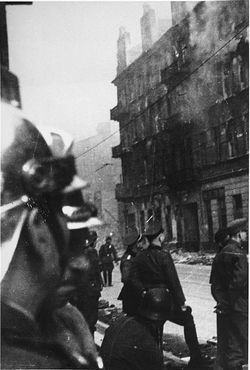 Warsaw Ghetto Uprising and SS Suppression Photos, April 19-May 16, 1943 - Polish firefighters and SS officers in the Warsaw ghetto during the suppression of the uprising