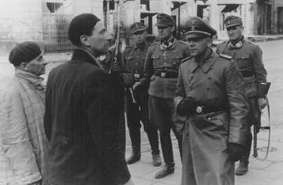 ss-police-leader-juergen-stroop-interrogates-two-jews-arrested-during-warsaw-ghetto-upri.jpg