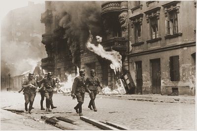 ss-troops-walk-past-block-burning-housing-during-suppression-warsaw-ghetto-upris.jpg