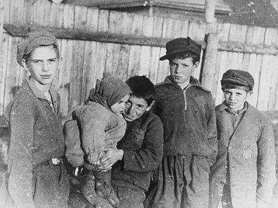 group-young-boys-holding-small-child-kovno-ghetto.jpg