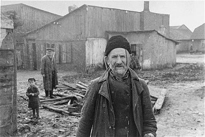 elderly-jew-stands-open-area-between-buildings-kovno-ghetto.jpg