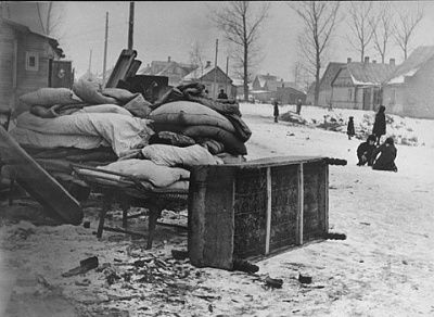 bedding-furniture-piled-up-residential-street-kovno-ghetto.jpg