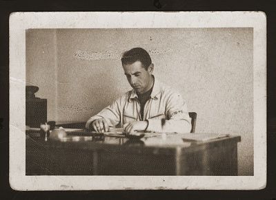 deputy-police-chief-yehuda-zupovitz-his-desk-kovno-ghetto.jpg