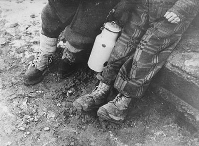 feet-two-young-children-milk-can.jpg
