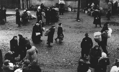 jews-carrying-bundles-possessions-before-their-deportation-kovno-ghetto.jpg