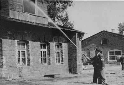 members-kovno-ghetto-firefighting-brigade-aim-hose-upstairs-window-house-.jpg