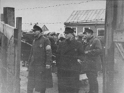 three-jewish-ghetto-officials-stand-one-gates-kovno-ghetto.jpg
