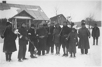 group-jewish-men-who-have-been-rounded-up-work-detail-shovel-snow-pose-outside-w.jpg
