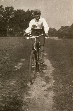 Kolbuszowa and Rzeszów Jewish Life and Ghetto Photos, 1929-1941 - A Jewish boy rides a bicycle in the Kolbuszowa ghetto