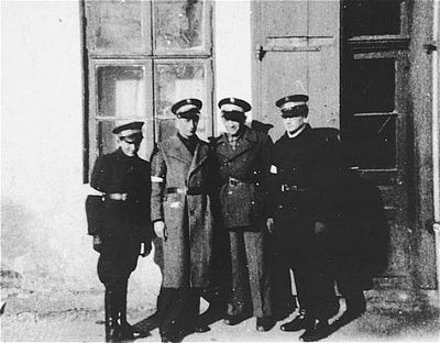 four-jewish-policemen-pose-street-kolbuszowa-ghetto.jpg