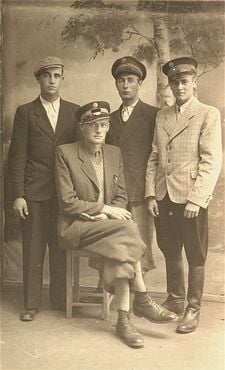 Group portrait of four Jewish policemen in the Kolbuszowa ghetto.jpg