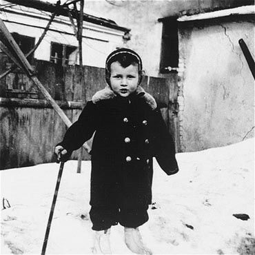 Kolbuszowa and Rzeszów Jewish Life and Ghetto Photos, 1929-1941 - Henoch Kornfeld poses with a cane outside in the snow in the Kolbuszowa ghetto