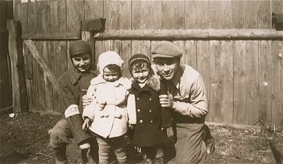 naftali-salesch-tz-poses-his-niece-nephews-front-wooden-fence-kolbuszowa.jpg