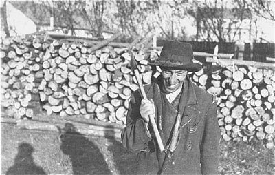 portrait-lejb-langweil-holding-ax-front-wood-pile.jpg