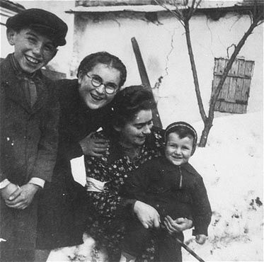 Kolbuszowa and Rzeszów Jewish Life and Ghetto Photos, 1929-1941 - Rachel Saleschütz poses with her niece and nephews outside in the snow in the Kolbuszowa ghetto