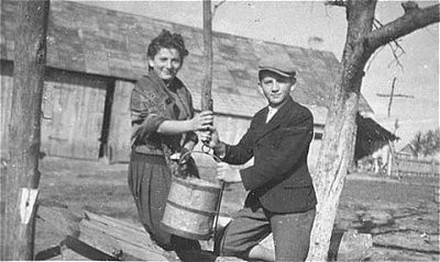 two-jewish-siblings-draw-water-well-kolbuszowa-ghetto.jpg