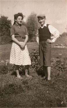 Two Jewish siblings pose outside in the Kolbuszowa ghetto.jpg
