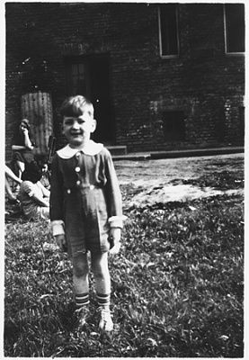 young-jewish-boy-poses-outside-rzeszow-ghetto.jpg