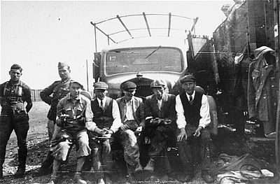 jewish-forced-laborers-pose-front-truck-work-site-rzeszow.jpg
