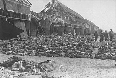 american-soldiers-stand-among-hundreds-corpses-laid-out-rows-outside-central-barracks.jpg