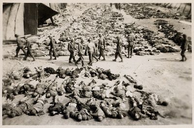 american-soldiers-walk-among-corpses-laid-out-rows-nordhausen-concentration-c.jpg