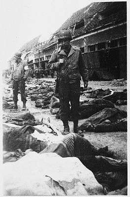 american-soldiers-walk-past-rows-dead-bodies-awaiting-burial.jpg